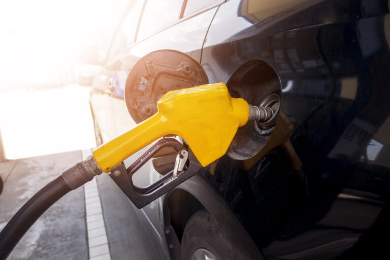 Close up of car is refilling oil fuel in Gas Station